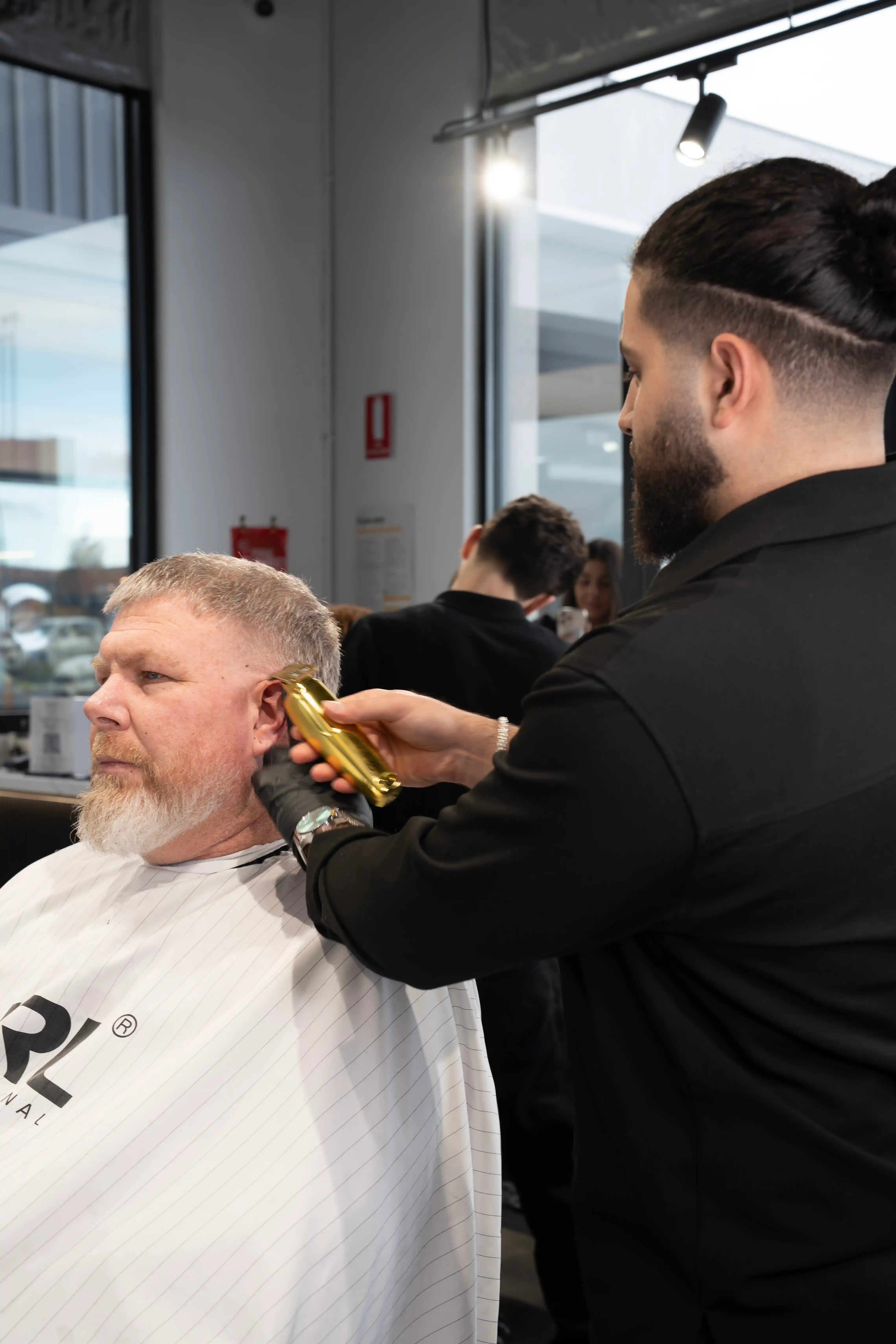 Stylist David Rossi creating a modern hairstyle